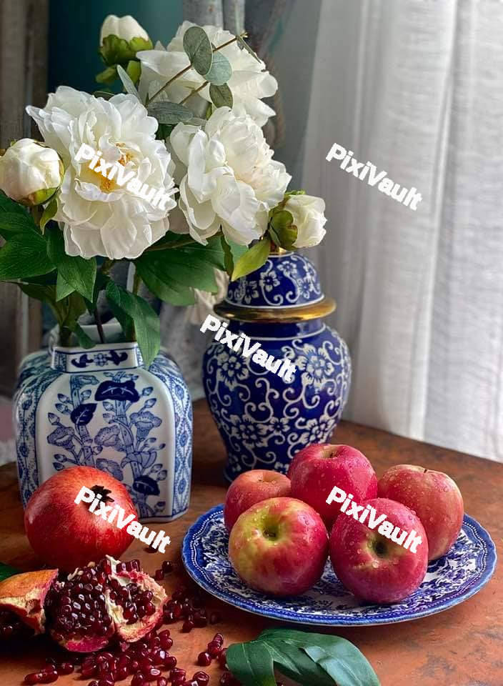 Red apples on a blue plate